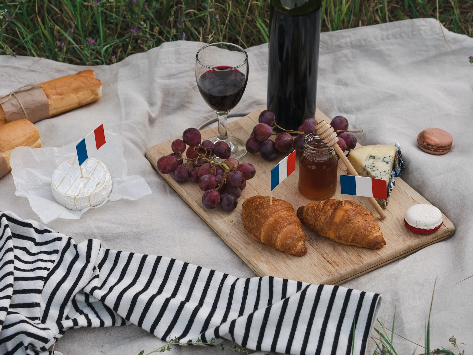 Croissants and wine on a charcuterie board