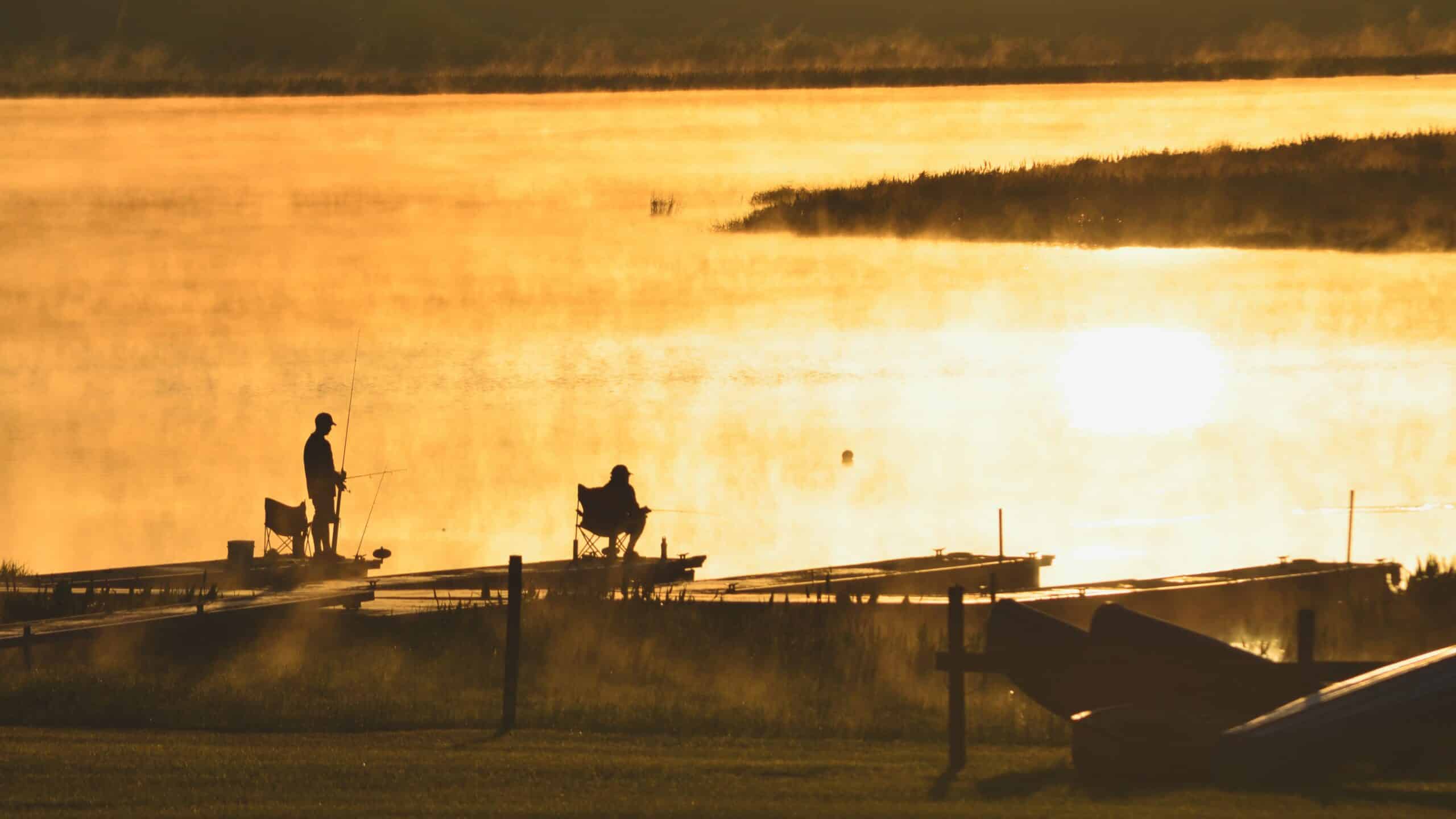 Two people fishing, a popular outdoor adventure activity in Panama City