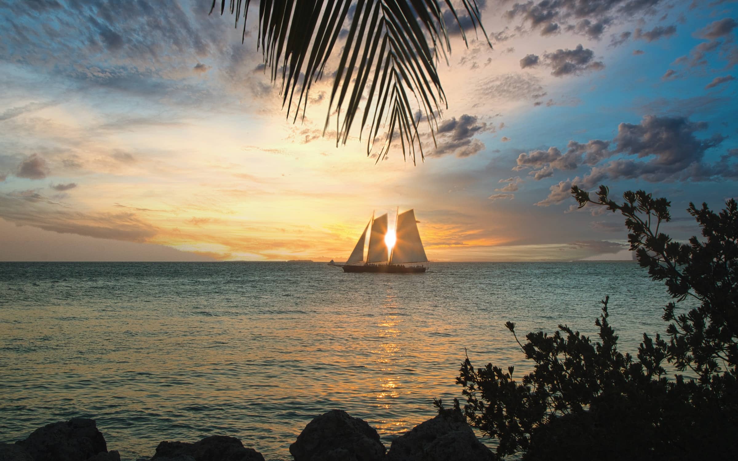 An oceanside view with a sunrise backdrop in one of the best vacation rentals in Key West.
