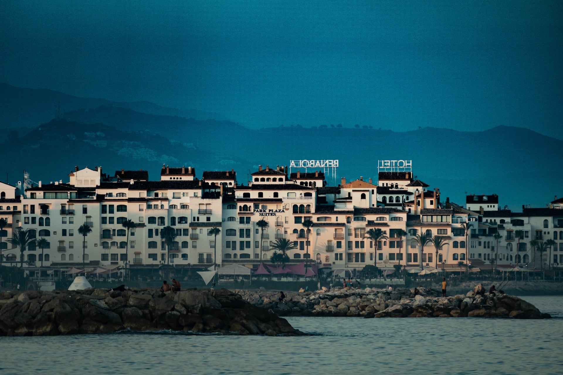 Concrete buildings near a body of water in Puerto Banús, Marbella, Spain